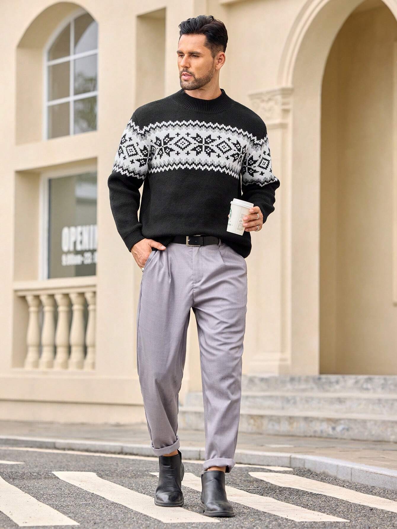 Ein-schwarzer-Pullover-mit-einem-weißen-Schneeflocken-und-Rauten-Muster,-perfekt-für-einen-schlichten-und-warmen-Winterlook