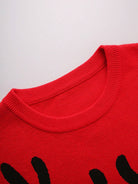 Ein-roter-Weihnachtspullover-mit-einem-großen-Rentiermotiv-und-einer-flauschigen-roten-Nase,-ideal-für-festliche-Anlässe